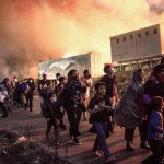 Merkel y Macron proponen que la UE reciba a migrantes de campamento griego incendiado